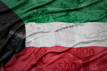 waving colorful national flag of kuwait on a euro money banknotes background. finance concept.