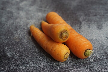 Carrots on a black background. healthy diet for eyes