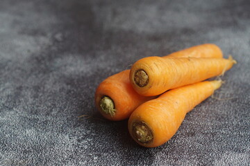 Carrots on a black background. healthy diet for eyes