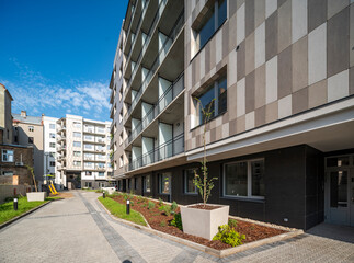 Courtyard and fasade of a modern residential house in a European city.