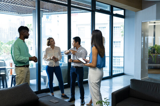 Diverse team discussing in modern office space