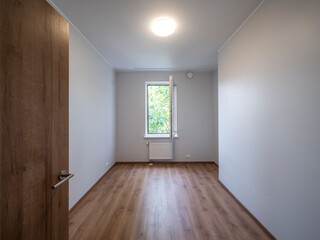 The interior of an apartment in a modern residential building in a European city.
