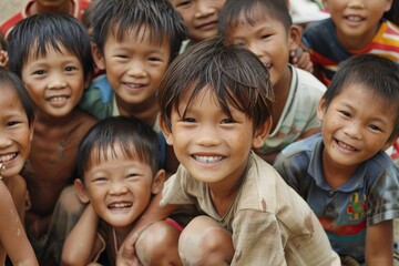 Group of asian children smiling and looking at the camera in the park