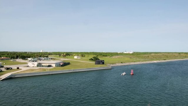 Coastal Services of Poseidon Wharf West and Memorial to original 41 for Freedom fleet ballistic missile submarines. Observation from deck during cruise ship departure from port Canaveral