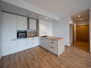 The interior of an apartment in a modern residential building in a European city.