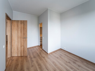 The interior of an apartment in a modern residential building in a European city.