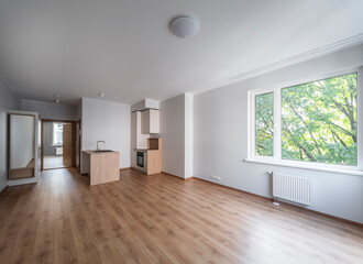 The interior of an apartment in a modern residential building in a European city.