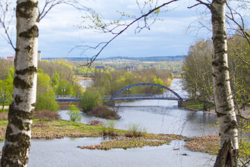 Sestroretsky public park and bridge over river Sestra at spring in Klin town, Moscow region, Russia 