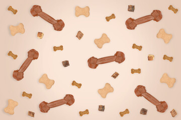 Top view on dog treats: cookies, biscuits, dried lung, bones lie on a beige background. Dog food...