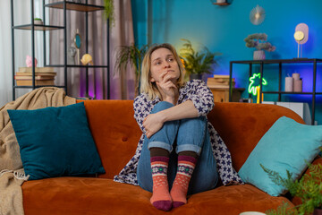 Sad lonely Caucasian woman looks pensive thinks over life concerns suffers from unfair situation...