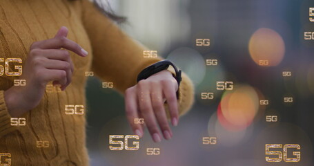 Image of multiple 5g text banners against mid section of a woman using smartwatch outdoors