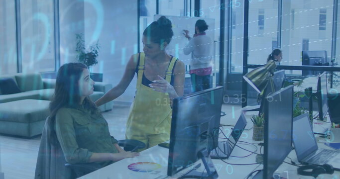 Image of statistical, stock market data processing over two diverse women discussing at office