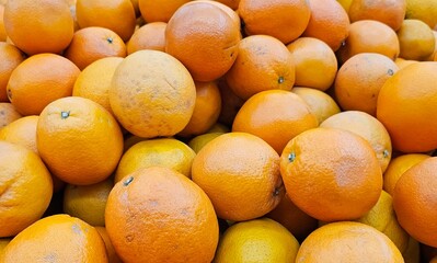 many oranges at the market, natural foods, raw foods, healthy foods, orange textured backgrounds, 