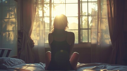 silhouette of woman sitting on the bed beside the windows with sunlight in the morning, dark light photography - Powered by Adobe
