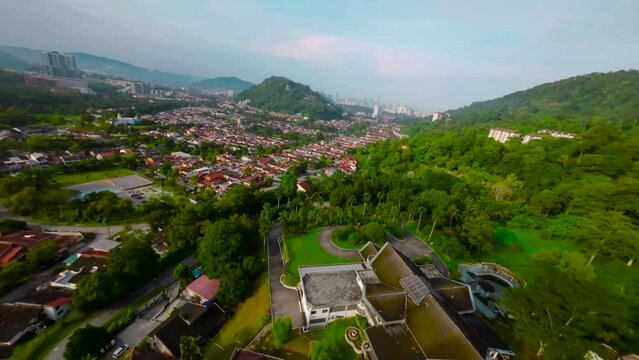 An aerial FPV view peak of rocky hills Bukit tabur during morning.