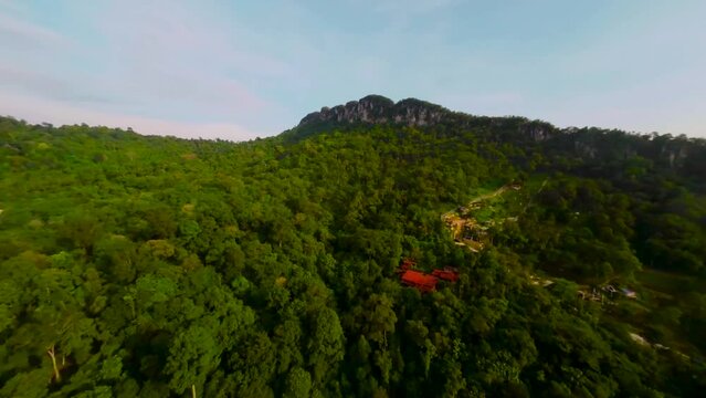 An aerial FPV view peak of rocky hills Bukit tabur during morning.