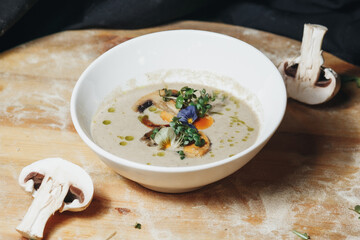 Savory Mushroom Herb Soup on Wooden Cutting Board