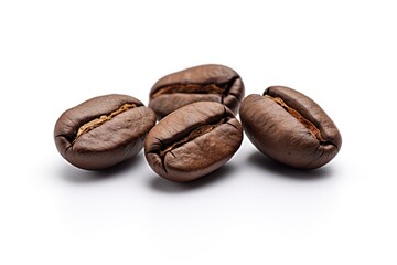 Coffee beans on isolated white surface closeup