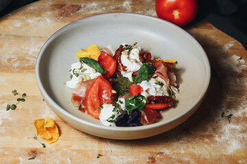 Sun-Kissed Tomatoes and Creamy Cheese on a Rustic Cutting Board
