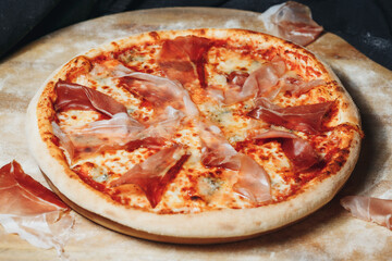 Pizza Perched on Wood,A freshly baked pizza sits atop a rustic wooden board