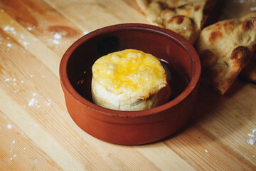 A Gourmet Delight: Cheese Bowl on Wooden Table