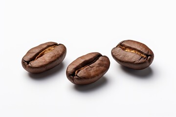 Naklejka premium Three coffee beans on isolated white surface