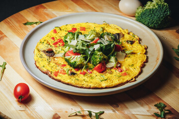 Broccoli Tomato Omelet Delight, A vibrant omelet featuring tender 