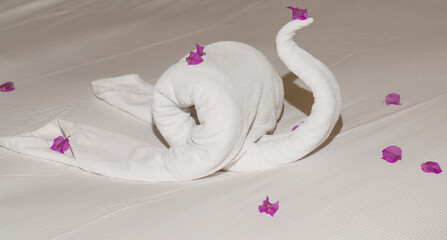 Creative cleaning of rooms in hotels in Egypt. The bed is decorated with objects made of towels.
