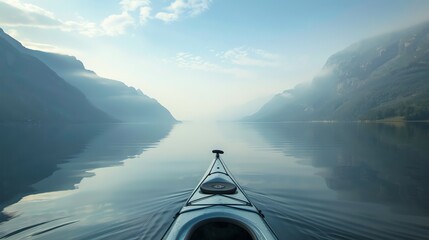 The image is of a person kayaking in a lake. The water is calm and clear. The sky is blue and there are some clouds in the distance. - Powered by Adobe