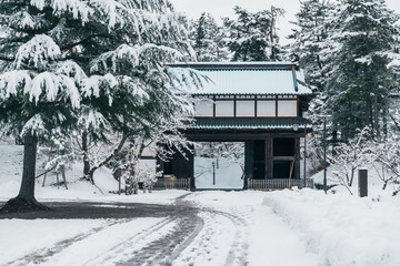 Hirosaki Castle gate or Takaoka Castle entrance with snow in winter, Japanese castle located in...