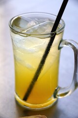 A popular Indonesian beverage, orange ice, made from freshly squeezed oranges, sugar, water, and ice cubes&mdash;a refreshing delight akin to iced tea.