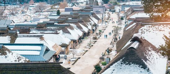 Ouchi Juku ancient farmer house village with snow in winter, former post town along the Aizu-Nishi Kaido trade route during the Edo Period. Shimogo town, Minamiaizu, Fukushima Prefecture, Japan