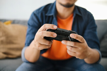 Close up Hands Using Console or Joystick Playing Video Game. 