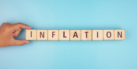 Inflation financial concept on wooden blocks isolated transparent