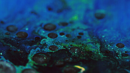 Glitter bubbles. Oil fluid. Blur blue green black color sparkling fizz circles texture paint blend splash abstract art background.