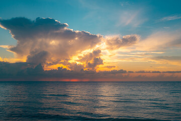 Sunset on sea background. Nature wallpaper with summer sea. Water sea texture. Calm sunrise on tropical sea. Ocean sunset background.