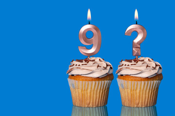 Birthday Cupcakes with Lit Number 9 and Question Mark candle