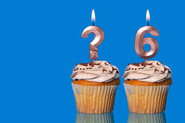 Birthday Cupcakes with Lit Question Mark Candle and Number 6