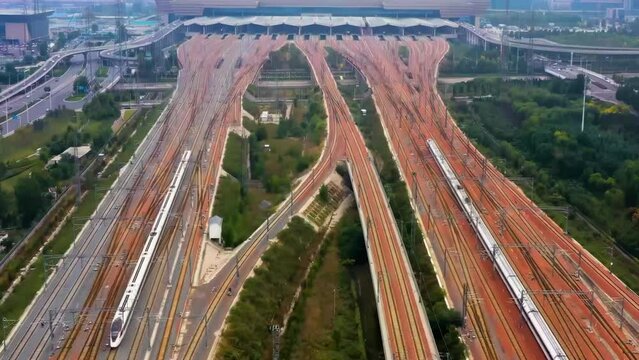 Footage Of Modern High Speed Express Train Pulling Into A Mainline Railway Station At Rail Line Station