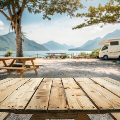 empty wooden tabletop for product display in camper van trailer parking lot with picnic table and beautiful mountain seaside or lake landscape, 