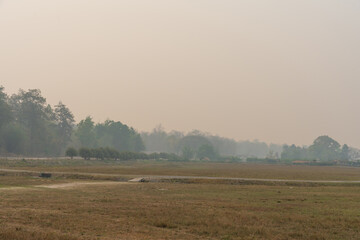 Countryside landscape mountains covered by smoke from fire forest burn, pollution problem pm. 2.5