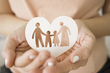 hands holding paper family cutout, foster care, homeless support, world mental health day, Autism support,homeschooling concept
