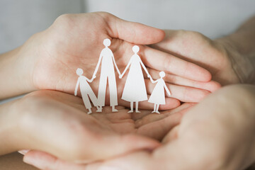 hands holding paper family cutout, foster care, homeless support, world mental health day, Autism...