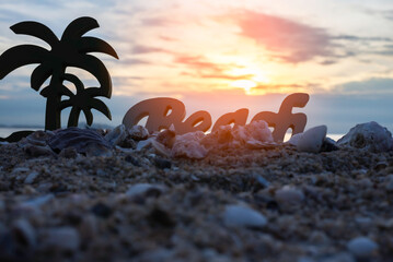 Beach at Sunset with in the alphabet . background Concept of summer vacations