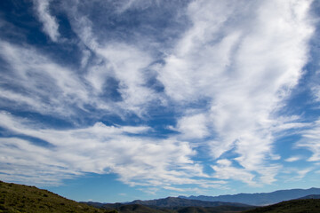 Fototapeta premium Clouds above rolling hills in the Boland in the Western Cape province of South Africa