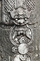 Ancient stone sculpture depicting a Chinese dragon at a temple in Thailand