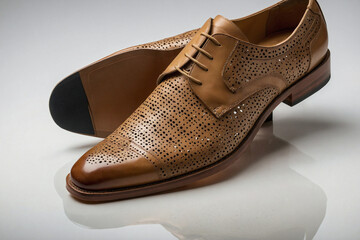 A versatile Derby shoe in a light tan color with subtle perforated detailing, bridging the gap between formal and casual office attire