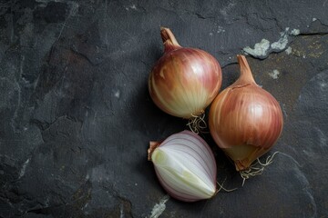 A fresh onion on the kitchen dark stone table, slightly sliced, flat lay with a place for text. AI generated