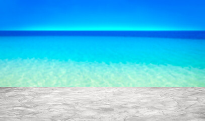 Cement counter top empty and background beach sand  blurred for of decorative design and product display montage ideas