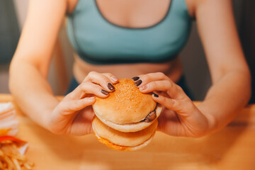 Binge eating disorder concept with woman eating fast food burger, fired chicken , donuts and...